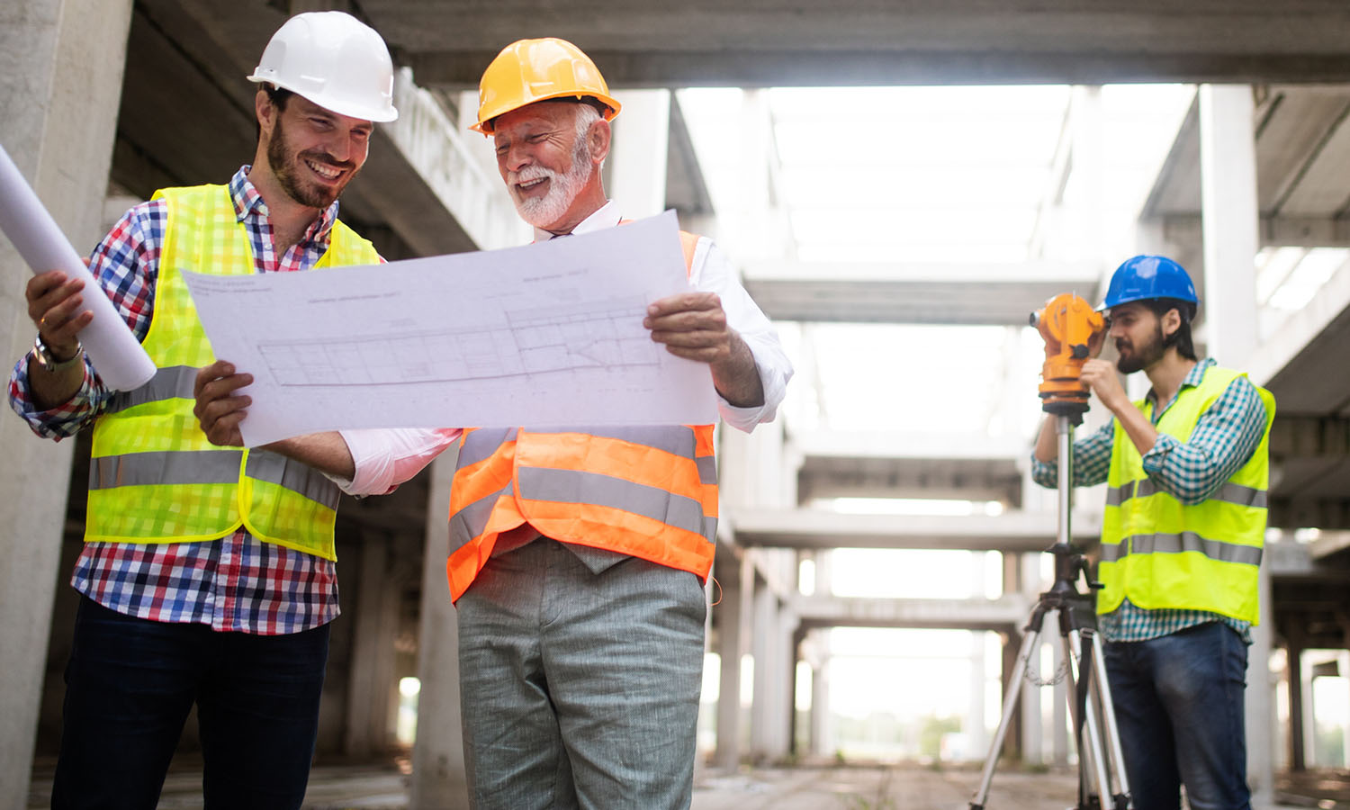 Construction contractors holding plan